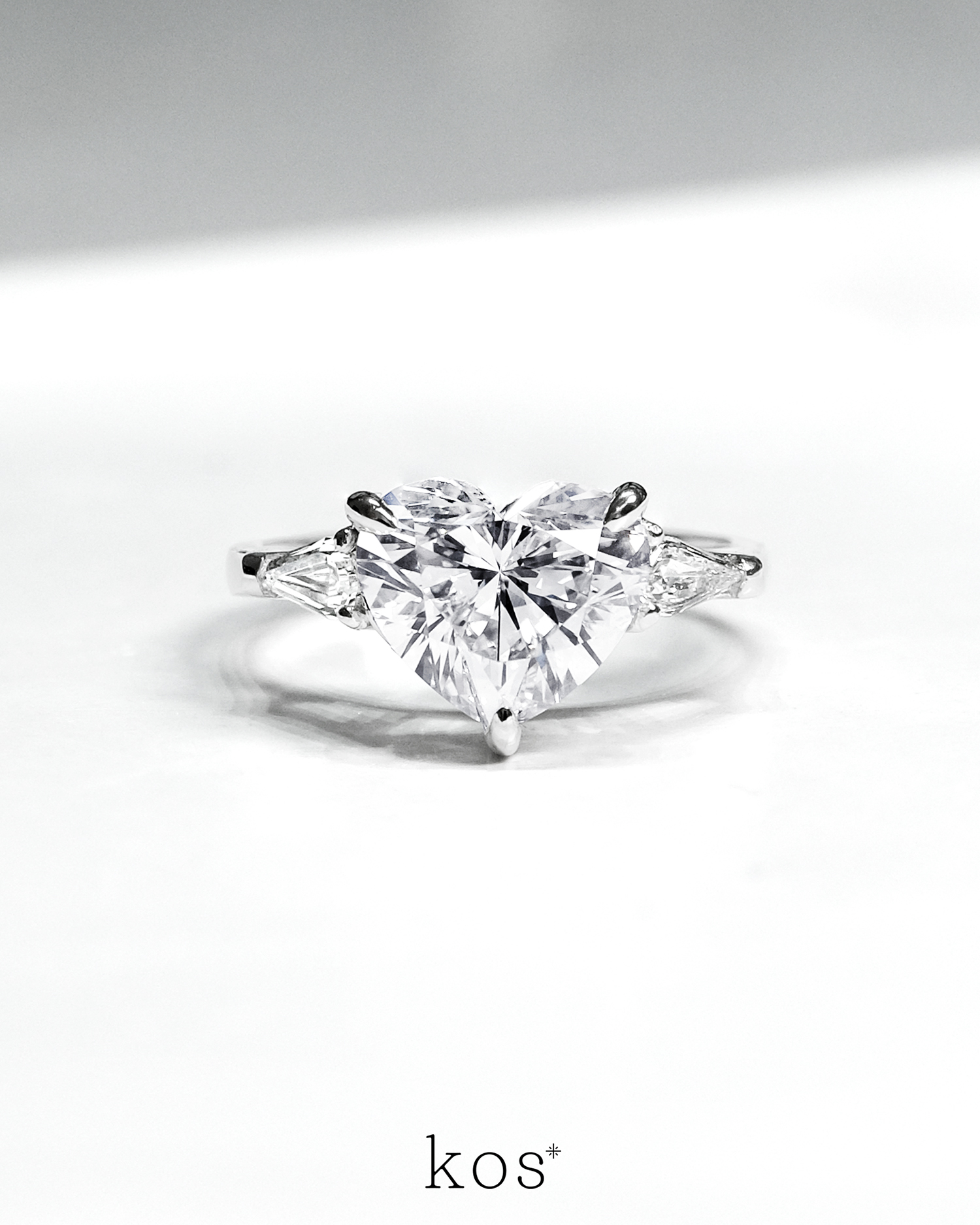 The Heart Ring with Pear Step Cut Side Diamonds